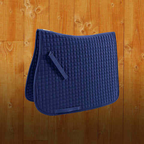 Blue quilted saddle pad on a wooden background